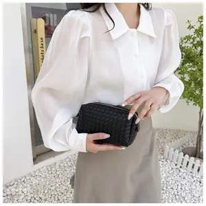 Black woven leather cosmetic pouch, stylish portable makeup clutch bag for daily use.