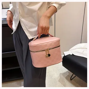 Pink checkerboard vanity bag with top handle and double zippers, stylish PU leather cosmetic case.