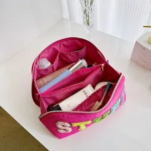 Stylish nylon makeup bag with embroidered letters, large capacity toiletry organizer.