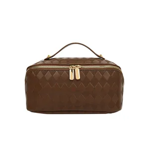 Brown quilted PU leather cosmetic bag with top handle and gold zippers for travel.
