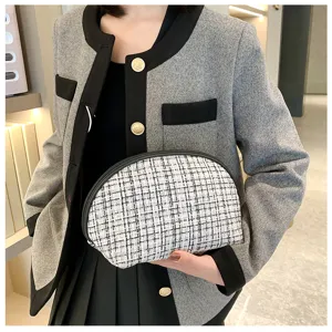 Chic semi-circular tweed cosmetic bag, compact portable makeup storage pouch for travel.