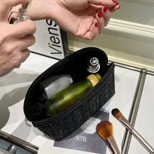 Chic tweed half-round cosmetic bag for women, portable travel makeup pouch and toiletry organizer.