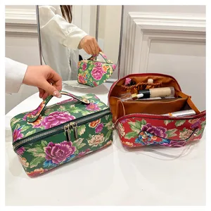 Chinese style floral makeup bag detail with large capacity, interior compartments and PU leather.