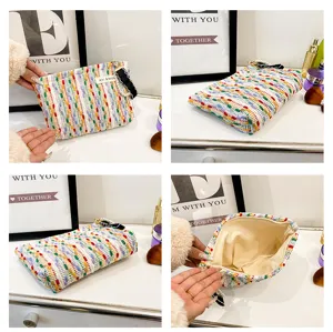 Colorful woven makeup pouch portable cosmetic storage bag with pearl zipper design for women.