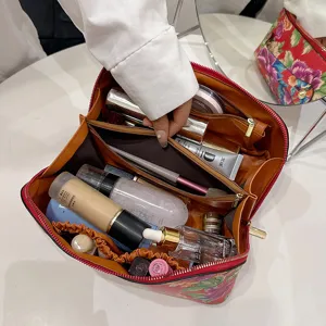 Large capacity floral PU leather cosmetic bag with multi-compartments for daily use.