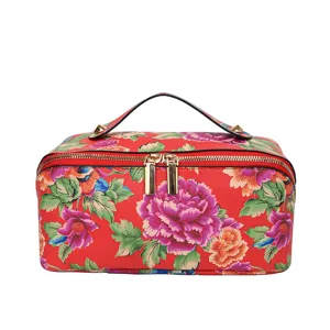Large capacity floral PU leather cosmetic bag with top handle and double zippers for daily use.