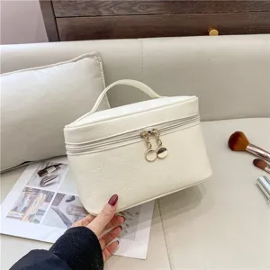 Minimalist white PU leather cosmetic bag, large capacity travel toiletry storage organizer.