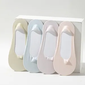 Detail view of four pastel women's invisible boat socks in beige, blue, purple, pink.