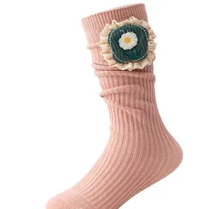 Cute girls pink slouch socks featuring a sweet floral embroidery patch with delicate lace trim.