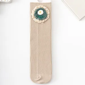 Cute girls spring floral mid-tube socks with lace trim, soft knit Mori style baby socks.