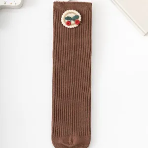 Cute brown ribbed mid-tube socks for girls, featuring sweet knitted cherry embroidery patch.