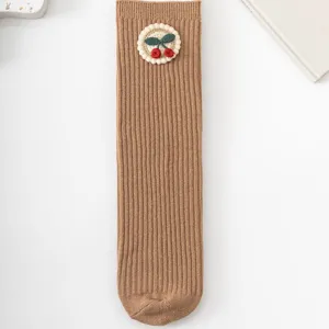 Cute baby girls brown ribbed mid-tube socks with sweet 3d cherry embroidery, soft toddler wear.