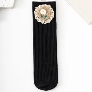 Cute floral lace embroidered girls black mid-calf ribbed socks flat lay main product view