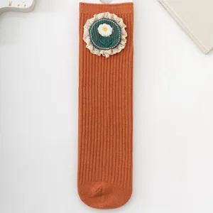 Cute floral girls mid-calf socks with delicate lace trim, perfect for autumn toddler wear.