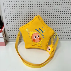 Children's cute star-shaped yellow canvas crossbody bag with cartoon print and shoulder strap.