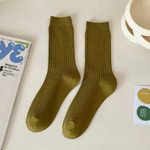 Women solid olive green ribbed mid tube cotton socks casual autumn daily wear flat lay.