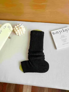 Black knitted stirrup leg warmers chunky knit winter cozy calf socks for women main display