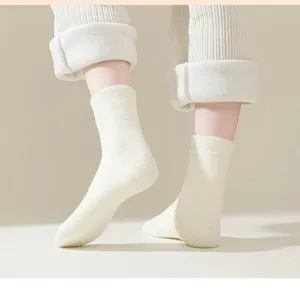 Cozy winter fleece women socks detail, thick warm solid color thermal stockings for cold days.