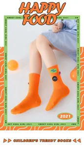 Children trendy bright orange mid-calf socks with cute patch and smiley face design.