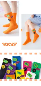 Autumn kids mid-tube socks with cute smiley face and letter embroidery, soft and colorful.
