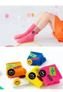 Autumn children mid-tube socks with cute smiley face and letter embroidery, soft and comfortable.