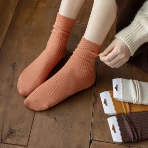 Orange women's wool slouch socks, stylish mid-tube knit thermal socks featuring sweet lace trim.