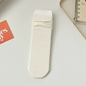 Women's solid color ribbed slouch socks, cute ruffle top crew socks for autumn and winter.