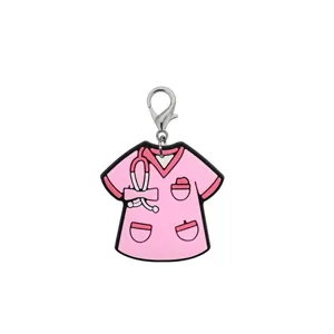 Detailed close-up of pink nurse scrub top PVC keychain charm with metal lobster clasp accessory.