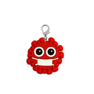 Detailed view of the red PVC virus keychain with a face mask, cute medical themed backpack charm.