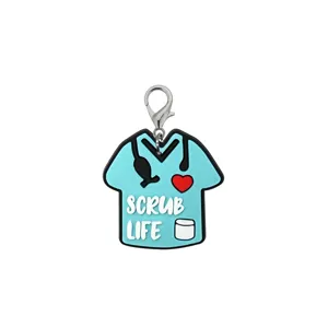 Close up view of the cute blue medical scrub uniform shape PVC keychain pendant accessory.