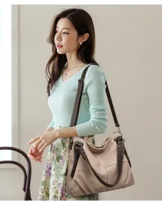 Sac cabas en cuir souple élégant avec bretelles marron contrastées pour un usage quotidien.