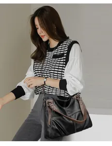 Sac cabas bandoulière souple en cuir vintage pour femme, grand format contraste élégant.