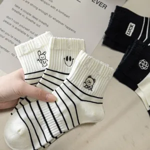 Cute black and white striped mid-calf cotton socks with lovely embroidered cartoon patterns.