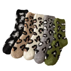 Cozy fuzzy coral fleece winter socks for women, thick warm sleep socks with leopard spots.