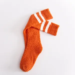 Fluffy coral fleece long socks for women, cozy winter warm fuzzy knee-high stockings with stripes.