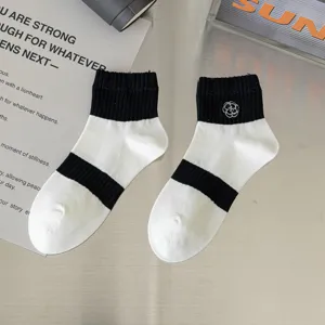 Women mid-calf cotton socks, black and white stripes with chic floral embroidery design.