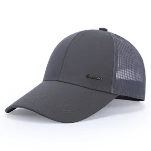 Detailed close-up of the dark grey mesh baseball cap showing metallic logo and breathable fabric.