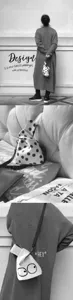 Detail view of the mini canvas crossbody bag featuring playful polka dot and cute eye graphic.