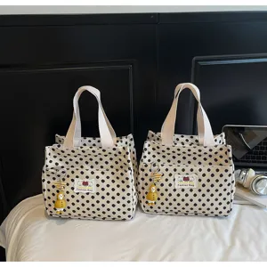 Cute polka dot canvas handbag for women, casual daily tote lunch bag with cute doll charm.