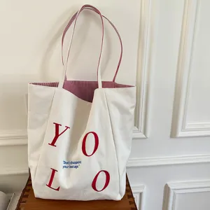 Casual canvas tote bag with red embroidered letters, double-sided design, large capacity for daily commute.