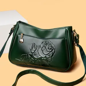 Donkergroene lederen schoudertas voor vrouwen, elegante tas met reliëf rozenmotief.