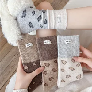 Cozy wool blend women's socks with cute leopard pattern and stylish color block design.