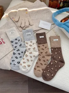 Cozy fall winter wool leopard print socks detail view, soft thick slouchy thermal women socks.