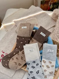 Cozy colorblock leopard print wool mid-calf socks with cute woven label for women.