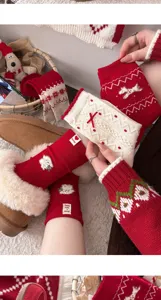 Thickened red winter warm long socks with cute dog embroidery and festive Christmas style.