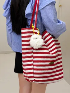 Red and white striped canvas tote bag, casual shoulder bag with plush pendant detail.