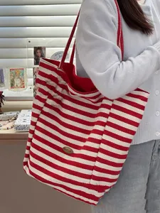 Red and white striped canvas tote bag detail view, casual large capacity shoulder shopping bag.