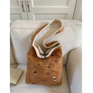 Brown corduroy shoulder bag with cute puppy embroidery and cozy plush lining for women.