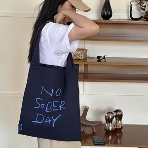 Casual navy blue canvas tote bag for women, large capacity shoulder bag for daily casual wear.