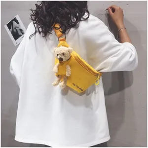 Yellow canvas chest bag with cute plush bear detail, casual crossbody style for daily use.